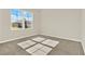 A sunlit bedroom featuring carpet and a window with neighborhood view at 5063 Marshelder St, Apopka, FL 32712