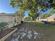 Side view of a backyard with a small garden plot and fenced perimeter at 508 W Crescent Dr, Lakeland, FL 33805