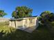 The exterior of this home is surrounded by grass, trees, and blue skies at 508 W Crescent Dr, Lakeland, FL 33805