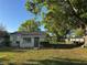 Charming home with newly landscaped front yard, green grass, and fenced gate at 508 W Crescent Dr, Lakeland, FL 33805