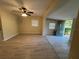 Spacious living room with modern ceiling fan, wood floors, and ample natural light at 508 W Crescent Dr, Lakeland, FL 33805