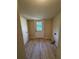 An entryway mud room offers vinyl floors and a windowed door to the backyard at 508 W Crescent Dr, Lakeland, FL 33805