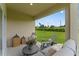 Relaxing covered patio with a view of the green lawn and sky at 5087 Marshelder St, Apopka, FL 32712