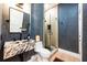 Stylish bathroom featuring a marble sink, modern fixtures, and a sleek glass-enclosed shower at 5101 The Oaks Cir, Orlando, FL 32809