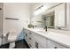 Modern bathroom featuring a double vanity with a long countertop and a glass-enclosed shower at 5101 The Oaks Cir, Orlando, FL 32809