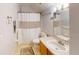 Cozy bathroom with tile flooring, a framed mirror, and shower with tub for relaxation at 5132 Luna Negra Dr, Orlando, FL 32811