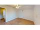 This spacious bedroom features neutral carpet, a ceiling fan, and plenty of natural light at 5132 Luna Negra Dr, Orlando, FL 32811