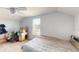 Bedroom featuring carpet flooring, a ceiling fan, a bed, and window with blinds at 5132 Luna Negra Dr, Orlando, FL 32811