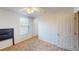 Bedroom featuring neutral carpet flooring, a ceiling fan, and a view from the window at 5132 Luna Negra Dr, Orlando, FL 32811