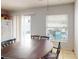 Cozy dining room featuring a classic table near the window at 5132 Luna Negra Dr, Orlando, FL 32811