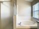 Bathroom featuring a soaking tub and walk-in shower at 527 Durango Loop St, Davenport, FL 33897