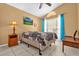 Bedroom with tile floors, ceiling fan, and natural light from the window at 527 Durango Loop St, Davenport, FL 33897