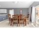 Dining area featuring tile floors, a ceiling fan, and a sliding glass door for natural light at 527 Durango Loop St, Davenport, FL 33897