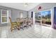 A formal dining room offers an open layout with access to a sun-filled screened-in patio at 527 Durango Loop St, Davenport, FL 33897