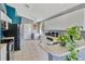 Bright and airy kitchen featuring white cabinetry, modern appliances, and an open design at 527 Durango Loop St, Davenport, FL 33897