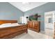 Main bedroom with tile floors, walk-in closet, and en-suite bathroom at 527 Durango Loop St, Davenport, FL 33897