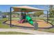 Neighborhood playground featuring slides, swings, and a covered play area for children at 527 Durango Loop St, Davenport, FL 33897