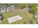 Aerial view of common recreation field, featuring a beach volleyball court and soccer goals at 527 Durango Loop St, Davenport, FL 33897