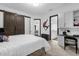 Bedroom featuring a barn door and a workspace with built-in storage at 6030 Greatwater Dr, Windermere, FL 34786