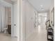 Hallway provides access to multiple rooms, offering a glimpse into the home's layout and design at 6799 Willow View Ave, Orlando, FL 32829