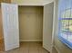 Bright closet with tiled flooring and natural light streaming through the window at 7109 Yacht Basin Ave # 430, Orlando, FL 32835