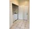 The laundry room has tile flooring and includes a modern washer and dryer at 7109 Yacht Basin Ave # 430, Orlando, FL 32835