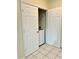 A tidy laundry area features tile flooring and washer and dryer hookups at 7109 Yacht Basin Ave # 430, Orlando, FL 32835