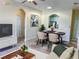 Inviting living room with dining area, neutral tones, and natural light, staged with modern furnishings at 7109 Yacht Basin Ave # 430, Orlando, FL 32835