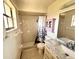 Bright bathroom with a shower, marble countertop, and colorful decorative accents at 716 Caribou Dr, Kissimmee, FL 34759