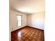 Bedroom featuring parquet flooring, a window, and natural lighting at 716 Caribou Dr, Kissimmee, FL 34759