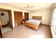 Bedroom featuring tile flooring, natural light, and a cozy bed at 716 Caribou Dr, Kissimmee, FL 34759