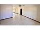 Bright living room with neutral tile flooring and access to outdoor patio at 716 Caribou Dr, Kissimmee, FL 34759