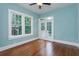 Bright bedroom featuring hardwood floors and glass doors at 719 S Summerlin Ave, Orlando, FL 32801