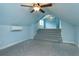 Spacious bedroom with carpet, ceiling fan, and stairs to another room at 719 S Summerlin Ave, Orlando, FL 32801