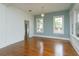 Bright living room with hardwood floors, accent lighting, and large windows at 719 S Summerlin Ave, Orlando, FL 32801