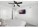 Bright bedroom with a ceiling fan and wall mounted TV at 824 Longboat Dr, Davenport, FL 33896