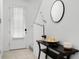 Hallway entrance, accented by a stylish side table with decor and a staircase to the left at 824 Longboat Dr, Davenport, FL 33896