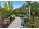 Charming putting green surrounded by lush landscaping, providing a relaxing outdoor recreation space at 824 Longboat Dr, Davenport, FL 33896