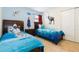 A bedroom with two beds themed with Frozen at 8801 Rhodes St, Kissimmee, FL 34747