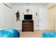 Bright bedroom featuring a TV and playful character decorations on the wall at 8801 Rhodes St, Kissimmee, FL 34747