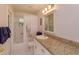 Bright bathroom featuring granite countertops, patterned shower curtain and ample counter space at 2930 Westgate Dr, Eustis, FL 32726