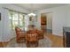 Traditional dining room featuring decorative chandelier and large sunny windows at 2930 Westgate Dr, Eustis, FL 32726