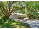 Home exterior with a large driveway and well-maintained landscaping at 2930 Westgate Dr, Eustis, FL 32726