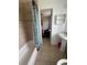 Small bathroom with a tub, shower with curtain, and a single sink vanity at 100 Huntswood Ct, Longwood, FL 32750