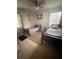 Neutral bedroom featuring tile floors and two beds with dark wood frames at 100 Huntswood Ct, Longwood, FL 32750