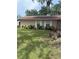 Charming single-story home with manicured lawn and mature landscaping at 100 Huntswood Ct, Longwood, FL 32750
