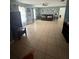 Spacious living room with tile floors, ceiling fan, and natural light at 100 Huntswood Ct, Longwood, FL 32750