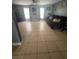 Spacious living room with tile floors, natural light, and contemporary decor at 100 Huntswood Ct, Longwood, FL 32750