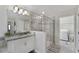 Bright bathroom with a glass-enclosed shower and modern vanity at 10509 Authors Way, Orlando, FL 32832