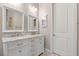 Bathroom featuring a double-sink vanity with marble countertop at 10544 Parkway Dr, Clermont, FL 34711